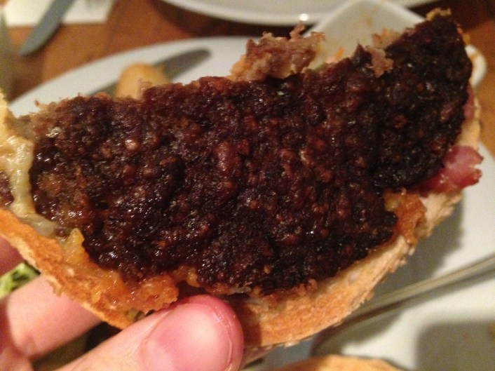 The patty was severely overcooked.