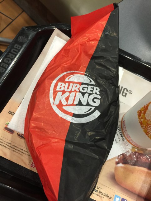 Unwrapping the black burger.
